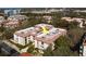 Aerial view of condominium complex with well-maintained landscaping and mature trees at 2612 Pearce Dr # 310, Clearwater, FL 33764