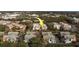 Aerial view showcasing a condo complex with well-maintained buildings and lush surrounding landscaping at 2612 Pearce Dr # 310, Clearwater, FL 33764