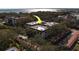 Aerial view of multi-unit residential building featuring white walls and a red tile roof at 2612 Pearce Dr # 310, Clearwater, FL 33764
