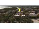 An aerial shot highlights a condo community near the bay, showcasing a tree-lined neighborhood at 2612 Pearce Dr # 310, Clearwater, FL 33764