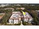 Aerial view of condominium complex with well-maintained landscaping and mature trees at 2612 Pearce Dr # 310, Clearwater, FL 33764