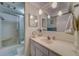 Updated bathroom with a vanity featuring pendant lighting, glass enclosed shower and a stylish sink at 2612 Pearce Dr # 310, Clearwater, FL 33764