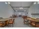 Bright clubhouse featuring multiple tables and chairs, and brick fireplace at 2612 Pearce Dr # 310, Clearwater, FL 33764