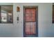 Condo entrance with decorative door, adjacent window, textured walls, and exterior light at 2612 Pearce Dr # 310, Clearwater, FL 33764