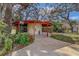 Outdoor structure with red pillars and roof; contains water fountain and gate at 2612 Pearce Dr # 310, Clearwater, FL 33764