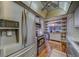Bright kitchen featuring stainless steel appliances, wood flooring, and custom lighting at 2612 Pearce Dr # 310, Clearwater, FL 33764