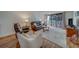 Comfortable living room with plush seating, hardwood floors, and access to the balcony at 2612 Pearce Dr # 310, Clearwater, FL 33764