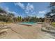Inviting community pool with surrounding lounge chairs and tropical landscaping at 2612 Pearce Dr # 310, Clearwater, FL 33764