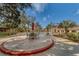 Outdoor patio surrounding a swimming pool with tables, chairs and umbrellas at 2612 Pearce Dr # 310, Clearwater, FL 33764