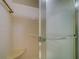 Close-up of a clean, tiled shower with a built-in seat and a clear glass door at 2612 Pearce Dr # 310, Clearwater, FL 33764