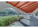 A covered walkway with elegant arches leads to a pool and community amenities at 2612 Pearce Dr # 310, Clearwater, FL 33764