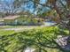 A charming green home with a pool view from the backyard at 309 11Th Sw St, Ruskin, FL 33570