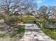 Charming single-story home with a well-manicured lawn, mature trees, and a spacious driveway at 309 11Th Sw St, Ruskin, FL 33570