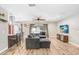 Comfortable living room featuring modern furniture, a ceiling fan, and access to the backyard at 3619 Woodhill Dr, Brandon, FL 33511