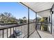 A balcony offering views of the parking lot and community landscape at 3711 W Iowa Ave # 214, Tampa, FL 33611