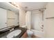 Practical bathroom with a standard tub and shower combo, paired with a granite sink at 3711 W Iowa Ave # 214, Tampa, FL 33611