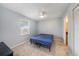 This simple bedroom is light and airy, featuring a ceiling fan and closet at 3711 W Iowa Ave # 214, Tampa, FL 33611