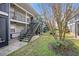 Charming exterior view of a multi-level apartment complex with lush landscaping at 3711 W Iowa Ave # 214, Tampa, FL 33611