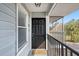 Inviting entryway with a classic black front door and covered porch area at 3711 W Iowa Ave # 214, Tampa, FL 33611