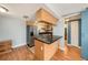 Cozy kitchen with black counters and stainless steel fridge, conveniently accessible to other rooms at 3711 W Iowa Ave # 214, Tampa, FL 33611