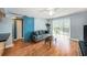 This inviting living room has an open layout with a sliding barn door and balcony entrance at 3711 W Iowa Ave # 214, Tampa, FL 33611