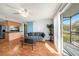 Bright living room boasts an open layout, modern kitchen view, and a sliding door leading to a balcony at 3711 W Iowa Ave # 214, Tampa, FL 33611