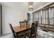 Well-lit dining room with wood table, seating for four, stylish light fixture, and natural light at 4537 22Nd N St, St Petersburg, FL 33714