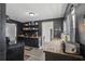 An interior view of the kitchen with a wooden countertop, dark cabinets and modern appliances at 4537 22Nd N St, St Petersburg, FL 33714