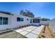 Home exterior showcases a modern concrete paver walkway with rock landscaping and fresh paint at 5731 17Th S Ave, Gulfport, FL 33707