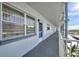 Building corridor with balconies, showing the structure and layout of the property with ample natural light at 5925 Shore S Blvd # 406, Gulfport, FL 33707