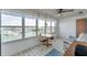 Bright dining area with water view through large windows, perfect for enjoying meals with a scenic backdrop at 5925 Shore S Blvd # 406, Gulfport, FL 33707
