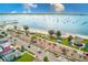 Aerial view of beachside community with beach access, picnic pavilions, and palm trees at 5980 Shore S Blvd # 1004, Gulfport, FL 33707