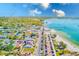 Aerial view of colorful beach town with turquoise water and boats on a sunny day at 5980 Shore S Blvd # 1004, Gulfport, FL 33707