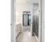 Bathroom with vanity, walk-in shower, and a seamless transition into the bedroom at 6307 113Th E Ter, Parrish, FL 34219