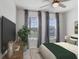 Cozy bedroom with a ceiling fan, natural light, and soothing decor at 6307 113Th E Ter, Parrish, FL 34219