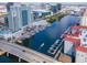 Stunning aerial view showcasing a waterfront property with boat docks and city skyline at 700 S Harbour Island Blvd # 738, Tampa, FL 33602