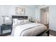 Bright, neutral bedroom with a comfortable bed, decorative pillows, and view to entry hall at 700 S Harbour Island Blvd # 738, Tampa, FL 33602