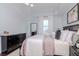 Stylishly decorated bedroom features a plush bed, dark wood furniture, and soft, natural light from the window at 700 S Harbour Island Blvd # 738, Tampa, FL 33602