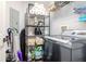 Well-organized laundry room featuring a modern washer, ample storage on wire shelving, and neatly stacked essentials at 700 S Harbour Island Blvd # 738, Tampa, FL 33602