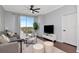 Bright living room with a large window, neutral colors, and sleek, modern furnishings at 700 S Harbour Island Blvd # 738, Tampa, FL 33602