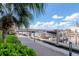 Picturesque waterfront view featuring the boat dock, a paved walkway, and palm trees at 700 S Harbour Island Blvd # 738, Tampa, FL 33602