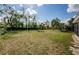 Wide angle shot of the backyard with the house in the background at 708 Oak Ridge Dr, Brandon, FL 33510