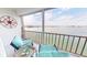 Relaxing condo balcony with seating and expansive views of the bay at 7910 Sun Island S Dr # 305, South Pasadena, FL 33707