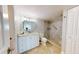 Well-appointed bathroom featuring a vanity, toilet, and walk-in shower with modern fixtures at 7910 Sun Island S Dr # 305, South Pasadena, FL 33707