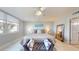 Bright bedroom features a waterfront view, comfortable gray lounge, and neutral tones for a relaxed atmosphere at 7910 Sun Island S Dr # 305, South Pasadena, FL 33707