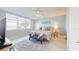 The bedroom features a large window with water view and a sitting area rug and pillows at 7910 Sun Island S Dr # 305, South Pasadena, FL 33707