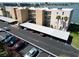 Condominium building featuring covered parking and water views at 7910 Sun Island S Dr # 305, South Pasadena, FL 33707