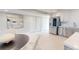 Modern kitchen with white cabinets and stainless steel appliances, open to the living space at 7910 Sun Island S Dr # 305, South Pasadena, FL 33707