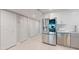 Kitchen boasts stainless steel appliances, white subway tile backsplash, and ample cabinet space for modern living at 7910 Sun Island S Dr # 305, South Pasadena, FL 33707