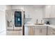 Beautiful modern kitchen features stainless appliances, including a refrigerator with viewing screen at 7910 Sun Island S Dr # 305, South Pasadena, FL 33707
